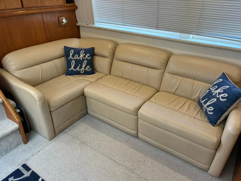 Slide: The Image of Beige leather sofa with "lake life" pillows in Carver 406 Aft Cabin Motor Yacht, 2000. - 45