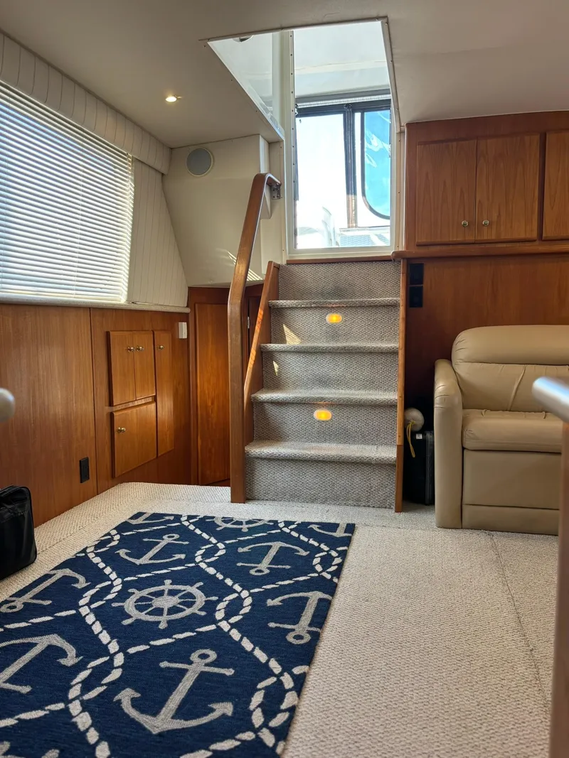Slide: The Image of Interior of 2000 Carver 406 Aft Cabin Motor Yacht with nautical-themed decor. - 46