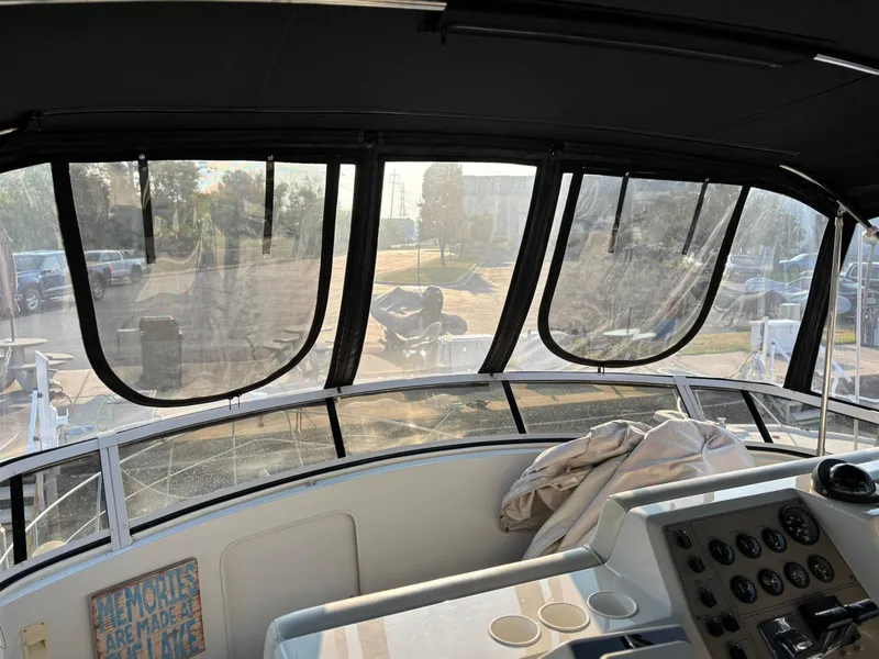 Slide: The Image of Interior view of 2000 Carver 406 Aft Cabin Motor Yacht cockpit with dashboard and windows. - 5