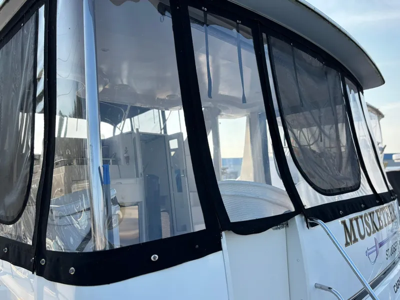 Slide: The Image of 2000 Carver 406 Aft Cabin Motor Yacht with enclosed deck, docked at marina. - 9