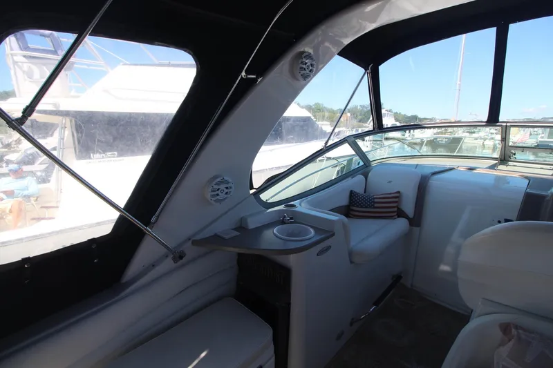 Slide: The Image of Interior of 2004 Four Winns 348 Vista yacht with seating and American flag pillow. - 11