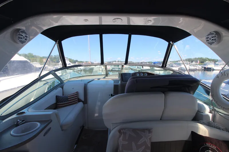 Slide: The Image of Interior view of 2004 Four Winns 348 Vista yacht at marina. - 12