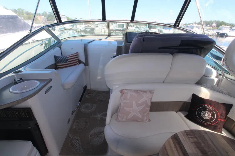 Slide: The Image of Interior of 2004 Four Winns 348 Vista boat with plush seating and nautical decor. - 13