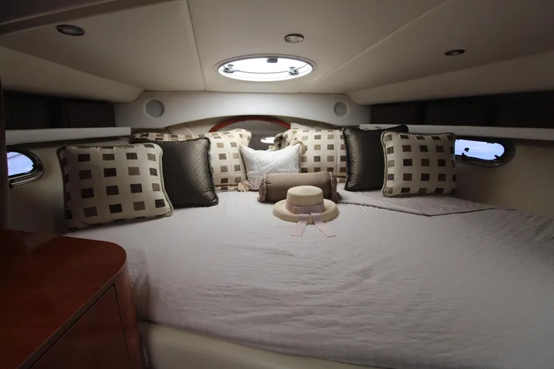 Slide: The Image of Luxurious cabin interior of 2004 Four Winns 348 Vista yacht with plush bedding. - 20