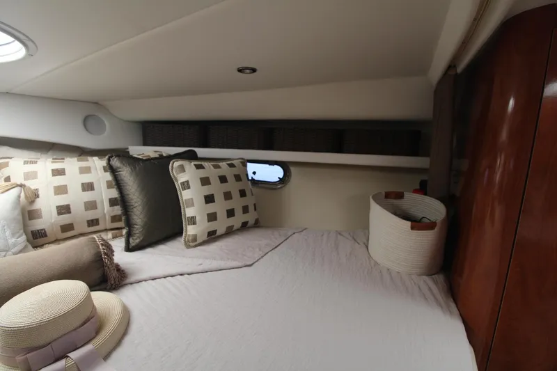 Slide: The Image of Cozy cabin interior of 2004 Four Winns 348 Vista with plush pillows and elegant decor. - 21
