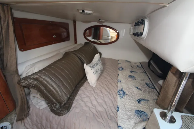Slide: The Image of Cozy cabin interior of 2004 Four Winns 348 Vista boat with plush bedding. - 26