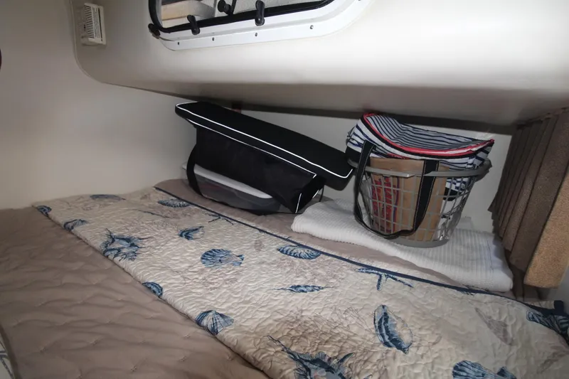 Slide: The Image of Interior cabin of 2004 Four Winns 348 Vista with bedding and storage bags. - 27