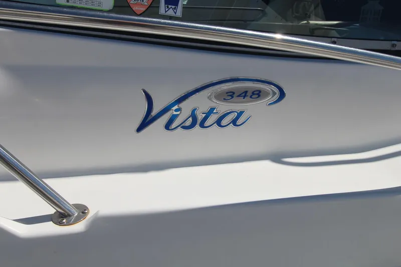 Slide: The Image of 2004 Four Winns 348 Vista boat logo with stainless steel railing. - 3