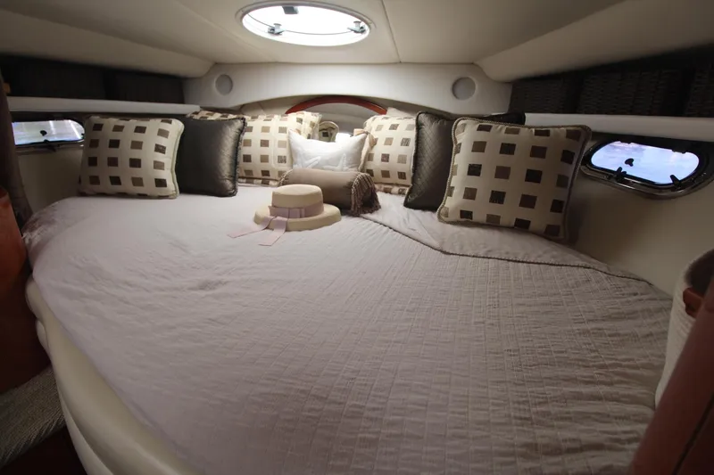 Slide: The Image of Luxurious cabin interior of 2004 Four Winns 348 Vista yacht with plush bedding. - 44