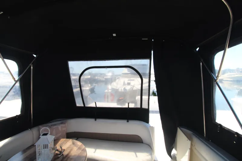 Slide: The Image of 2004 Four Winns 348 Vista boat interior with seating and table. - 7