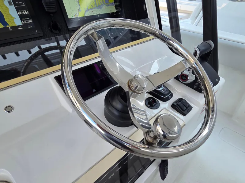 Slide: The Image of Steering wheel of 2023 SeaVee 37 Z boat with navigation controls. - 17