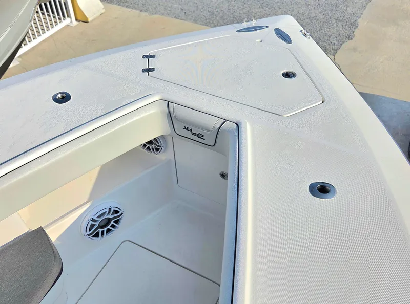 Slide: The Image of 2023 SeaVee 37 Z boat deck with storage compartments and speaker. - 24