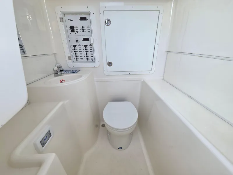 Slide: The Image of 2023 SeaVee 37 Z boat interior with toilet and control panel. - 27