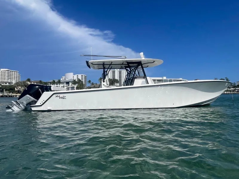 Slide: The Image of 2023 SeaVee 37 Z boat on water, clear sky, modern design. - 6