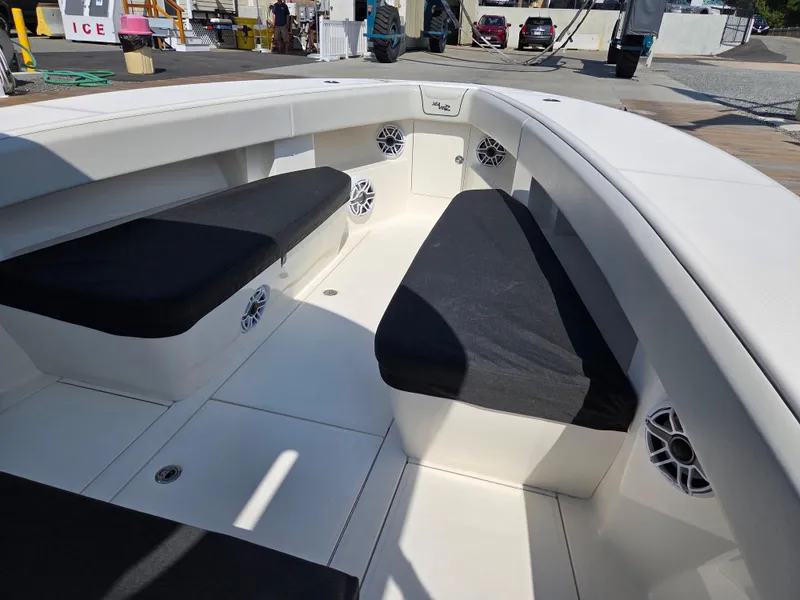 Slide: The Image of 2023 SeaVee 37 Z boat interior with cushioned seating and speakers. - 7