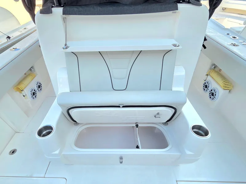 Slide: The Image of 2023 SeaVee 37 Z boat interior with storage compartment and cup holders. - 9