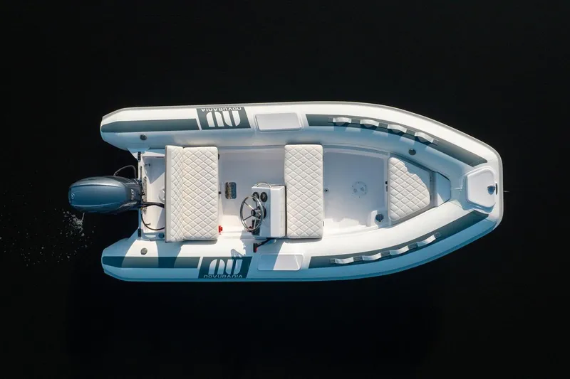 Slide: The Image of Overhead view of 2026 Novurania DL 400 boat on dark water. - 11