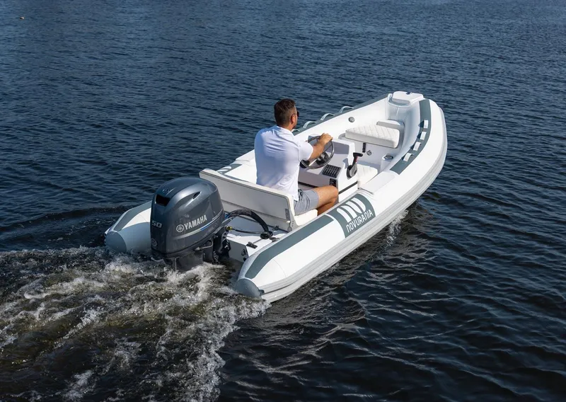 Slide: The Image of 2026 Novurania DL 400 boat with Yamaha engine on water, rear view. - 14