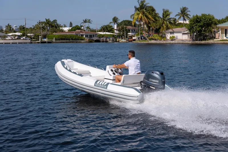 Slide: The Image of Novurania DL 400 boat cruising on a sunny day, 2026 model. - 15