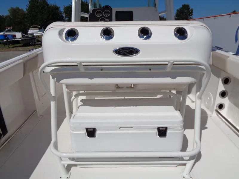 Slide: The Image of 2017 Robalo R260 Center Console boat interior with rod holders and storage. - 12