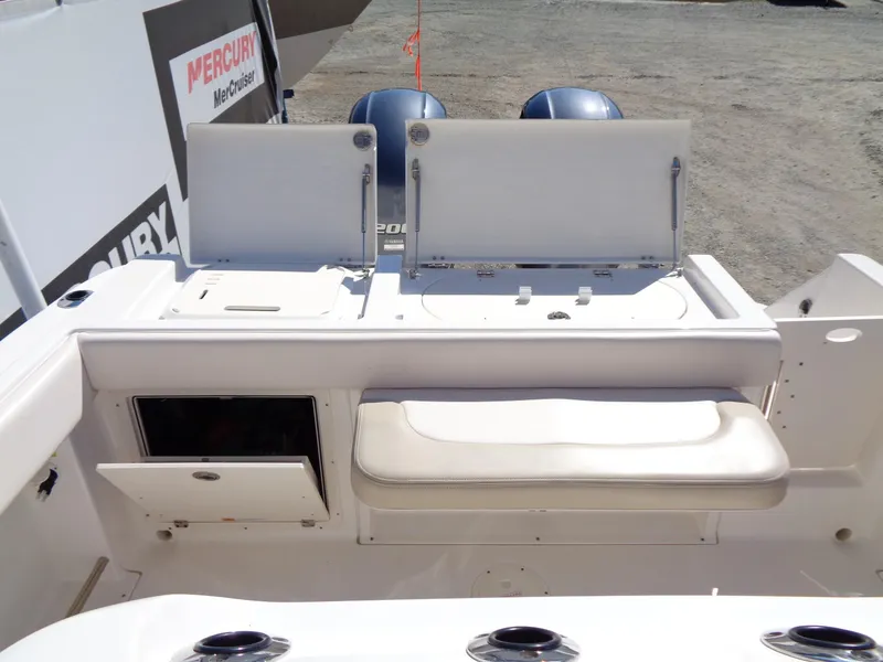 Slide: The Image of 2017 Robalo R260 Center Console boat interior with seating and storage compartments. - 13