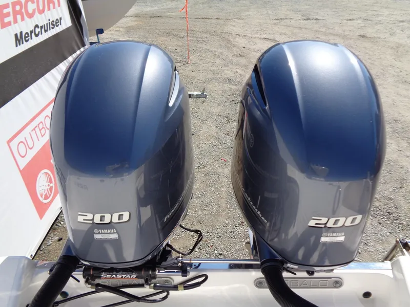 Slide: The Image of Twin Yamaha 200 outboard engines on a 2017 Robalo R260 Center Console boat. - 15
