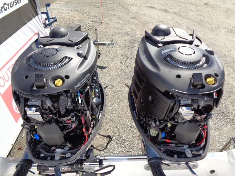 Slide: The Image of Twin outboard engines on a 2017 Robalo R260 Center Console boat. - 16