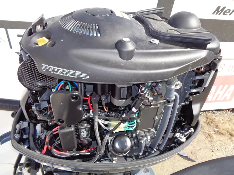 Slide: The Image of Open engine of a 2017 Robalo R260 Center Console boat, showcasing internal components. - 19