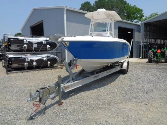 Slide: The Image of 2017 Robalo R260 Center Console boat on trailer, parked outside a storage facility. - 24