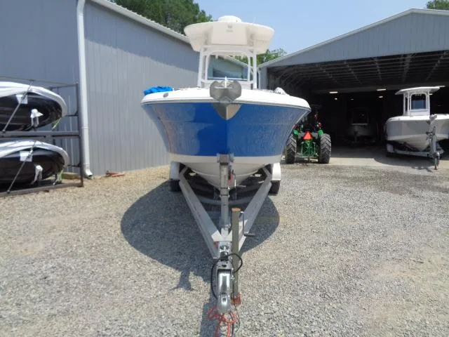 Slide: The Image of 2017 Robalo R260 Center Console boat on trailer, parked outside a storage facility. - 25