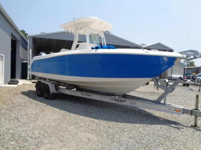 Slide: The Image of 2017 Robalo R260 Center Console boat on trailer outside storage facility. - 26