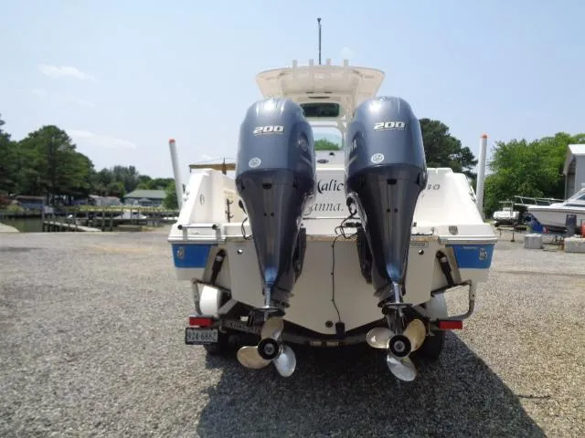 Slide: The Image of 2017 Robalo R260 Center Console with twin 200 horsepower engines, rear view. - 29