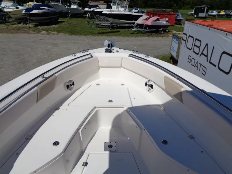 Slide: The Image of 2017 Robalo R260 Center Console boat interior with seating and storage compartments. - 3