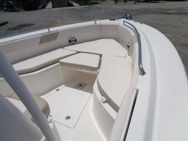 Slide: The Image of 2017 Robalo R260 Center Console boat with spacious seating and sleek design. - 31