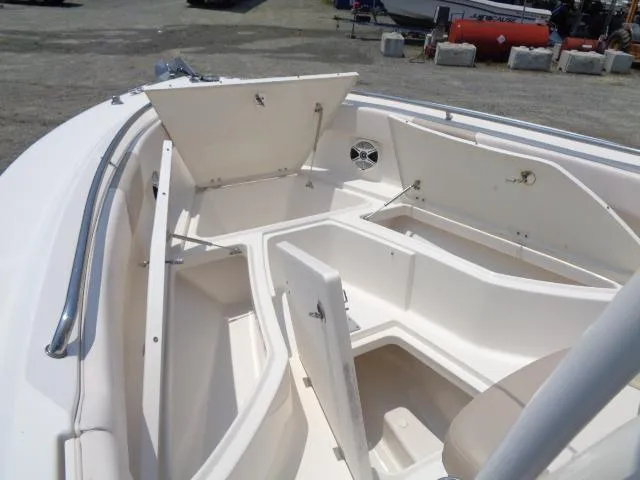 Slide: The Image of 2017 Robalo R260 Center Console boat with open storage compartments. - 33