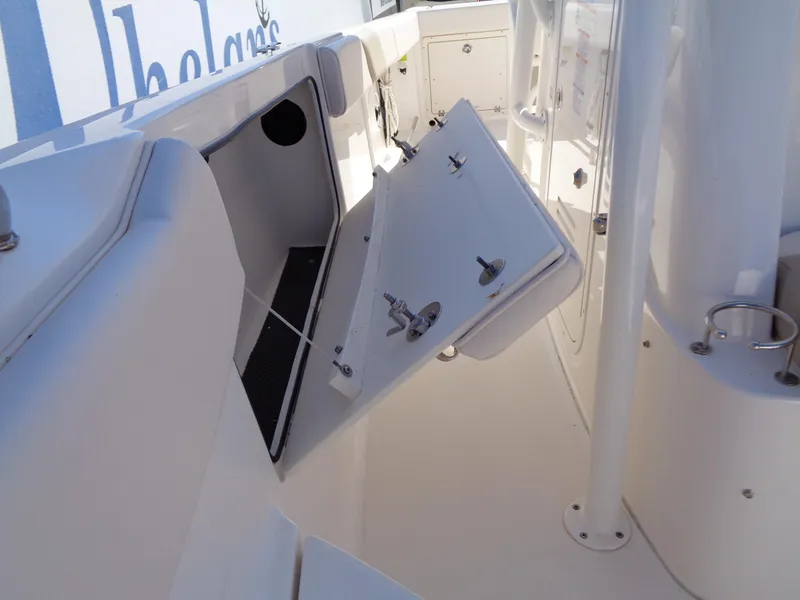 Slide: The Image of 2017 Robalo R260 Center Console boat interior with open storage compartment. - 7