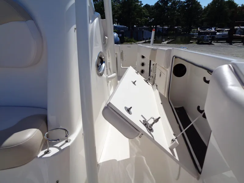 Slide: The Image of 2017 Robalo R260 Center Console boat interior with open storage compartment. - 8