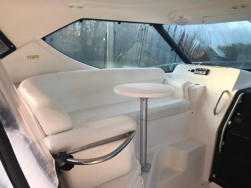Slide: The Image of 2008 Tiara Yachts 3900 Sovran interior with white seating and table. - 10