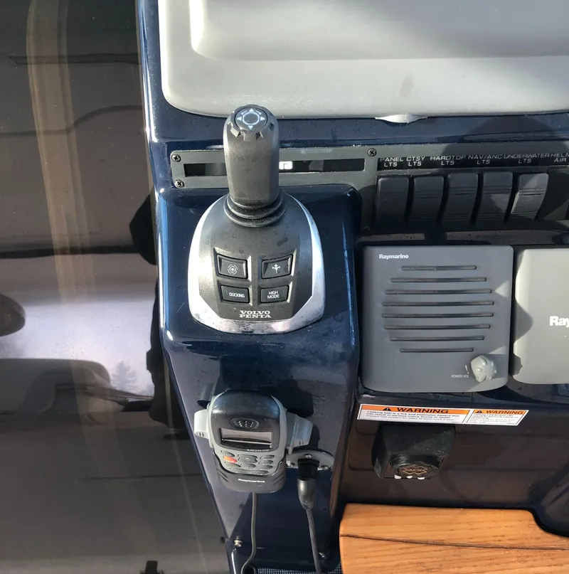 Slide: The Image of 2008 Tiara Yachts 3900 Sovran control panel with joystick and navigation equipment. - 14