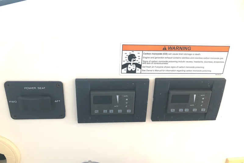 Slide: The Image of Control panel of 2008 Tiara Yachts 3900 Sovran with warning label. - 18