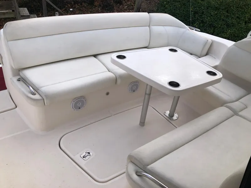 Slide: The Image of 2008 Tiara Yachts 3900 Sovran cockpit with white seating and table. - 21