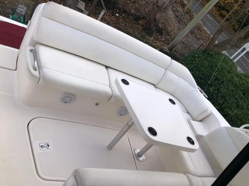 Slide: The Image of 2008 Tiara Yachts 3900 Sovran cockpit with white seating and table. - 22