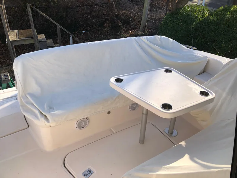 Slide: The Image of 2008 Tiara Yachts 3900 Sovran cockpit with covered seating and table. - 23