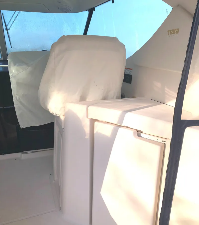 Slide: The Image of 2008 Tiara Yachts 3900 Sovran interior with covered seating and helm area. - 28