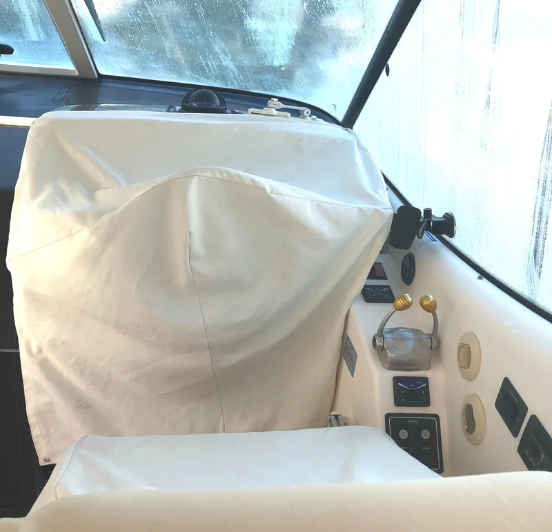 Slide: The Image of 2008 Tiara Yachts 3900 Sovran helm with covered seat and control panel. - 30