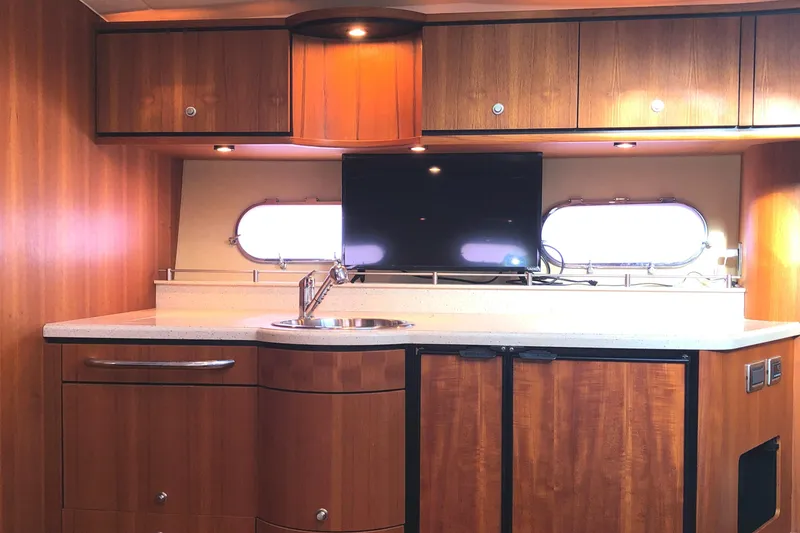 Slide: The Image of Interior of 2008 Tiara Yachts 3900 Sovran with wood cabinetry and modern amenities. - 42