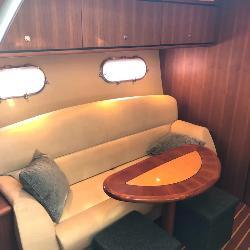 Slide: The Image of 2008 Tiara Yachts 3900 Sovran interior with cozy seating and elegant wooden table. - 44