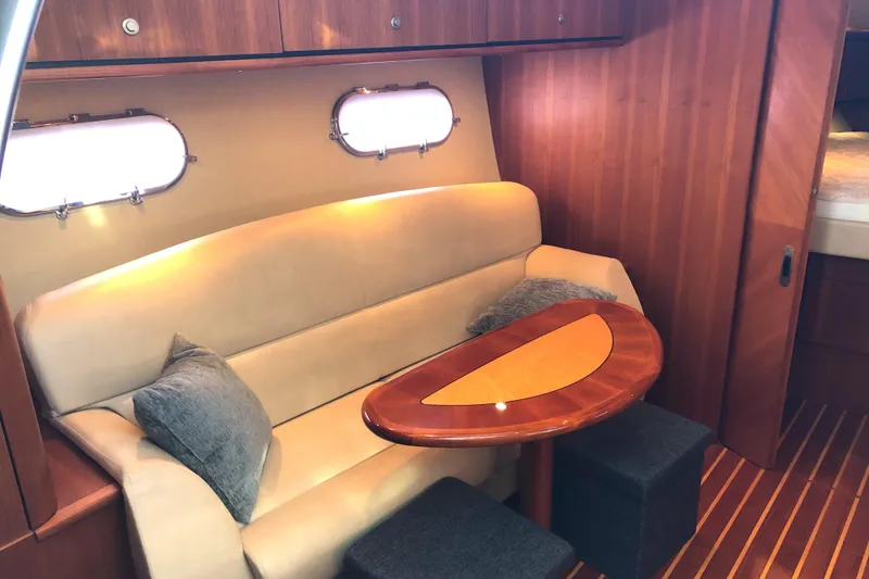 Slide: The Image of 2008 Tiara Yachts 3900 Sovran interior with cozy seating and elegant wooden table. - 46