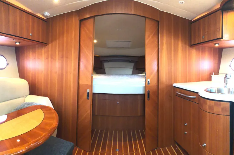Slide: The Image of Luxurious interior of 2008 Tiara Yachts 3900 Sovran with wood finish and cozy cabin. - 47
