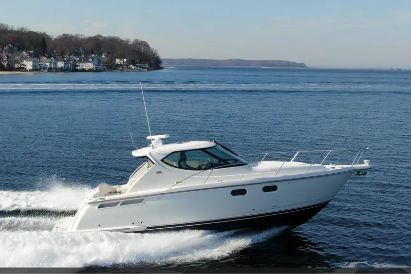 Slide: The Image of 2008 Tiara Yachts 3900 Sovran cruising on open water. - 8